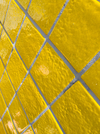 Diagonal pattern of yellow tiled wallの写真素材