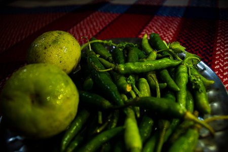 Fresh Lemons and green chilliesの写真素材