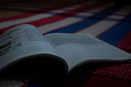 Book lying on the bedの写真素材