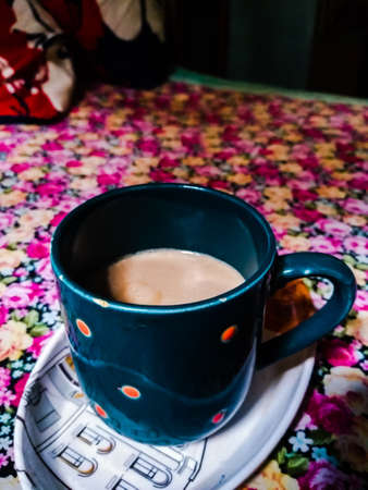 A cup of coffee on the bedの写真素材