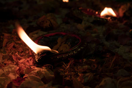 Floor decorated with flowers and diyas on the occasion of diwaliの写真素材