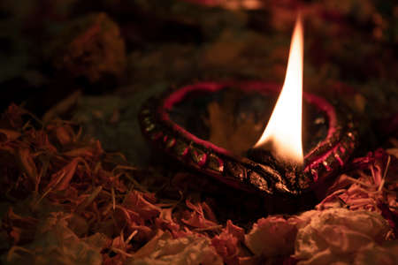 Floor decorated with flowers and diyas on the occasion of diwaliの写真素材