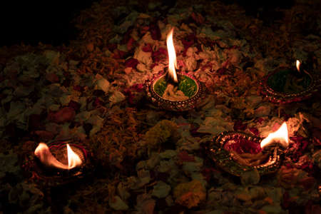 Floor decorated with flowers and diyas on the occasion of diwaliの写真素材