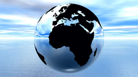 chrome earth against blue sky on waterの写真素材