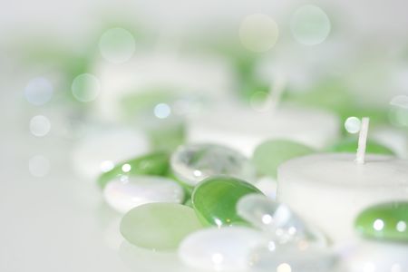 Candles surrounded by glass beadsの写真素材