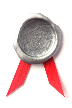 Silver wax seal with red ribbonの写真素材