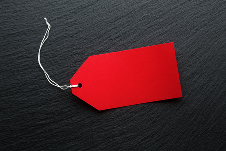 Blank price tags on dark backgroundの写真素材