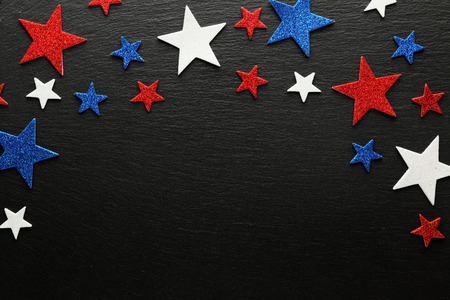 Red, white, and blue stars on slate backgroundの写真素材
