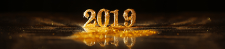 2019 in sparkling gold numbers celebrating the New Yearの写真素材