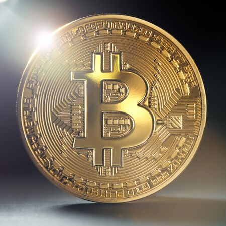 Close up of a single golden bitcoin coin in shining light.  Wealth, digital, virtual, currency, and cryptocurrency concept.の写真素材