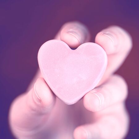Hand holding blank converstation heartの写真素材