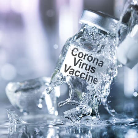 Coronavirus vaccine vial breaking into pieces with splashing liquid. Failure to create a vaccine, find a cure for the corona virus, or the dangers of an untested drug concept.の写真素材