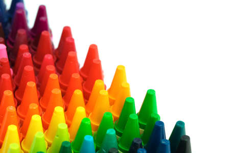 Box of crayons in a rainbow of colors with blank white spaceの写真素材
