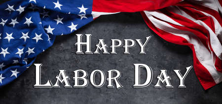 US American flag on worn black background. For USA Labor day celebration. With Happy Labor Day text.の写真素材