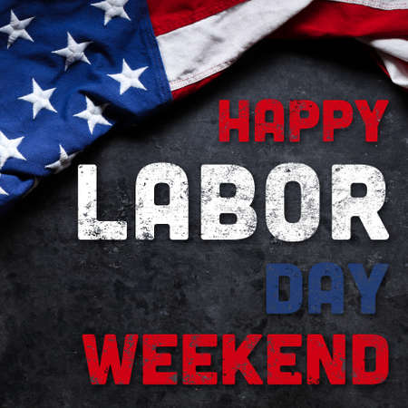US American flag on worn white wooden background. For USA Labor day celebration. With Happy Labor Day Weekend text.の写真素材