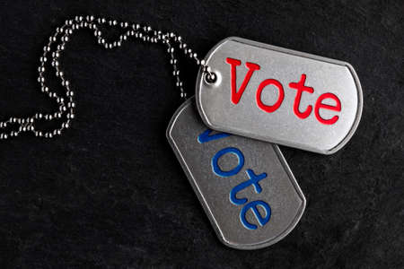 Old and worn military dog tags - Voteの写真素材