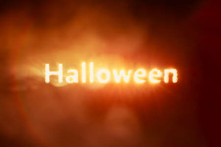 Glowing Halloween text burning red and orange smokeの写真素材