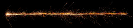 Sparkler trail of light with sparks in a straight line.の写真素材