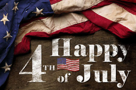Happy fourth of July text with red, white, and blue American Flagの写真素材