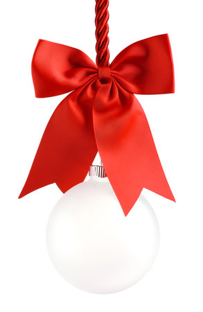 Clear Christmas ornament hanging from shiny red ribbon and bow. Empty space in bauble for text or product. Isolated on white.の写真素材