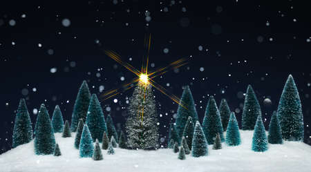 Snowing winter wonderland with miniature tree decorations and a sparkling star on Christmas tree.の写真素材