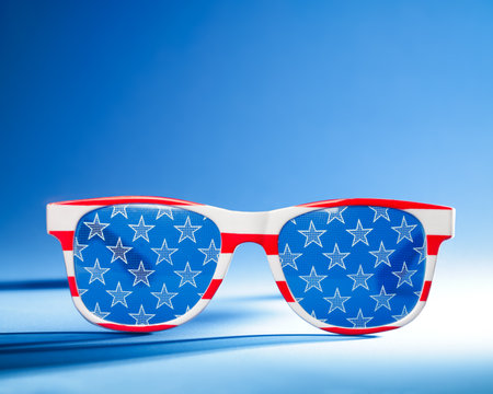 Cool red, white, and blue sunglasses in the pattern of the US American flag. For USA 4th of July or other patriotic celebrations.の写真素材