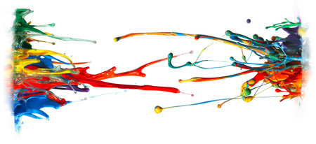 Abstract paint and ink in a rainbow of colors splashing into the air, frozen motion in a creative and unique shape.の写真素材