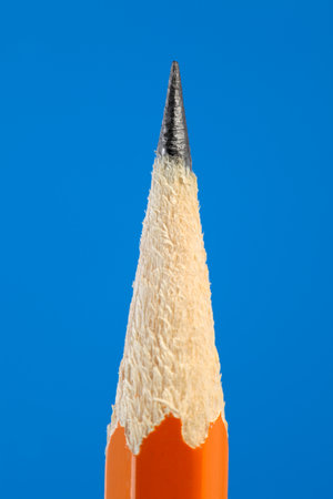 Close up of yellow pencil tip on blue backgroundの写真素材