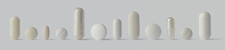 Row of white pill tablets and capsules. Concept for addiction, over medicated, or a variety of healthcare options.の写真素材