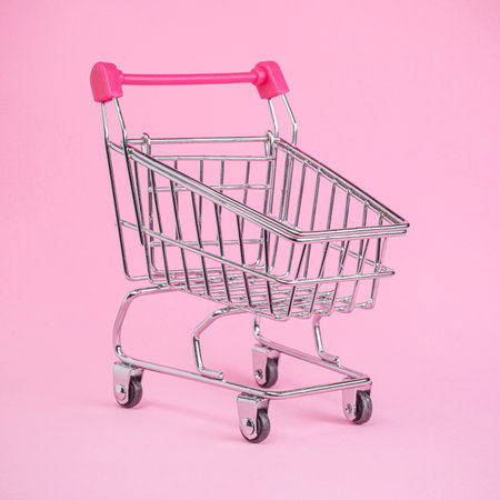 Empty shopping basket or grocery cart on bright pink.の写真素材