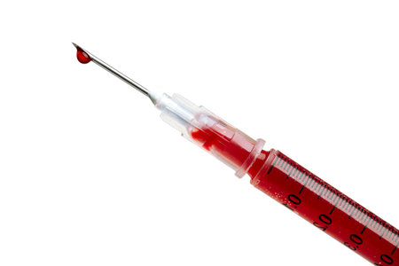 Sharp syringe leaking bloodの写真素材
