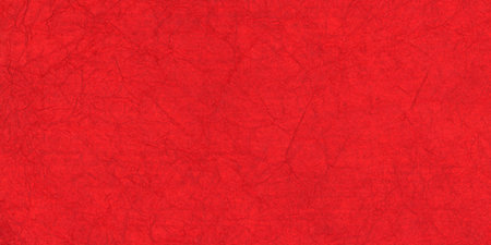 Textured red paper with rough wrinkled lines. Crumpled red paper background.の写真素材