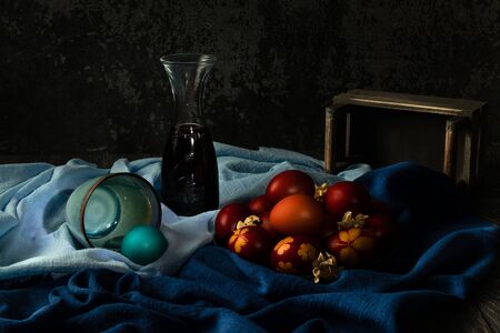 Easter dyed eggs with natural onion color in dark and moody atmosphereの写真素材