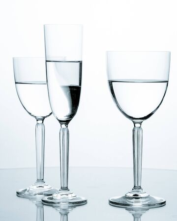Elegant wineglasses on white background with reflectionの写真素材