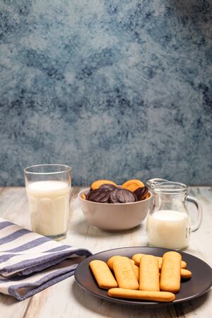Delicious biscuits with milk glass on a table topの写真素材