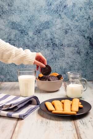Delicious biscuits with milk glass on a table topの写真素材