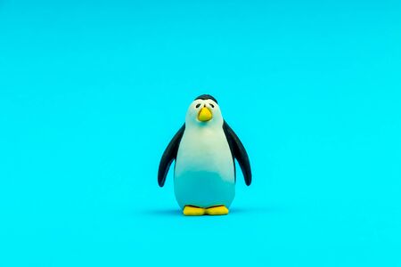 Small animal figure toy for children on a blue background isolatedの写真素材