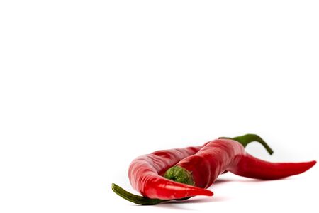 Red hot chili peppers isolated on white backgroundの写真素材
