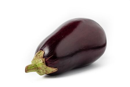 Whole, purple and shiny eggplants isolated on a white background.の写真素材