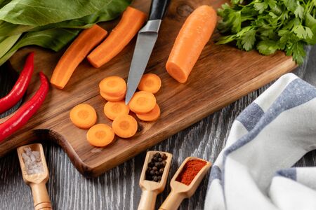 Healthy Organic Vegetables on the Wooden Background. Zucchini, carrots, red hot chili peppers, onionの写真素材