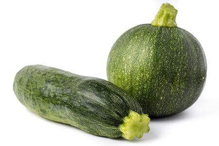 Fresh yellow and green zucchini isolated on white background. Yellow courgettes. Yellow squash.の写真素材