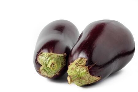 Whole and purple eggplants isolated on white backgroundの写真素材