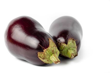 Whole and purple eggplants isolated on white backgroundの写真素材