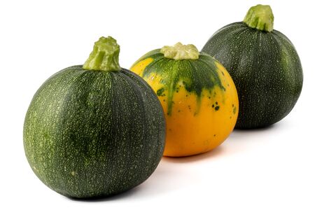 Fresh yellow and green zucchini isolated on white background. Yellow courgettes. Yellow squash.の写真素材