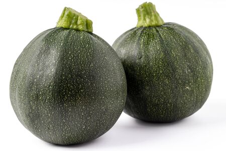 Fresh yellow and green zucchini isolated on white background. Yellow courgettes. Yellow squash.の写真素材