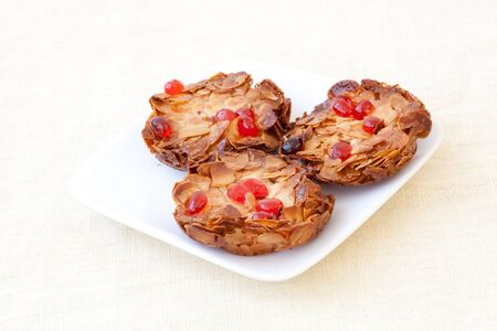 three cookies on white plateの写真素材