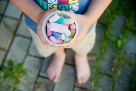 chalk in the hands of a childの写真素材