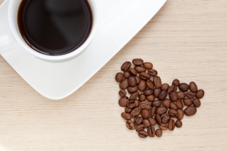 Coffee Cup with beans in the form of heartの写真素材