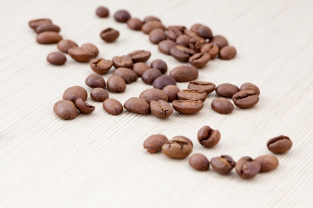 Coffee beans on wooden tableの写真素材