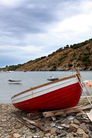 wooden red boat in the harborの写真素材